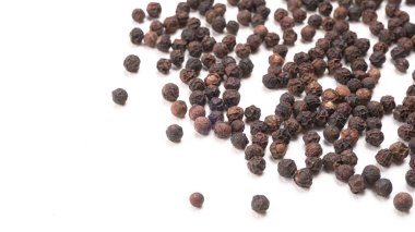 Group of Organic Black pepper isolated on white background. Selective focus and Top view (Flat Lay)