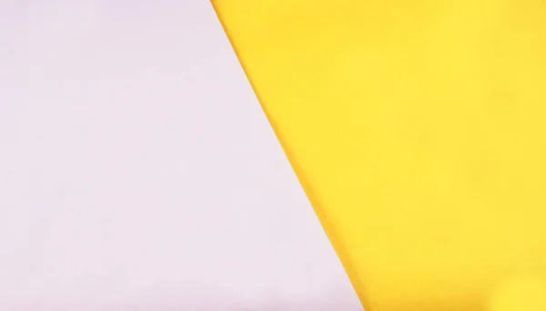 Sarı ve beyaz kağıt arka plan. Birincil renk kavramı. Açı ve köşegen çizgiler. Üst görünüm düzlüğü kopyalama alanı ile yatıyordu.