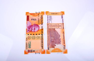 Yepyeni Hint para birimi banknotları, 200 rupi. Başarı ve işten kazanç sağlamak. Mal ve hizmetlere GST vergisi.