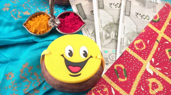 Pile of Indian Money With Traditional Indian Bracelet Calls Rakhi, Sister Ties On Brothers Wrist on the Ocassion of Raksha bandhan