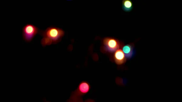 Unscharfe Weihnachtsbeleuchtung Auf Schwarzem Hintergrund Abstrakter Hintergrund — Stockfoto