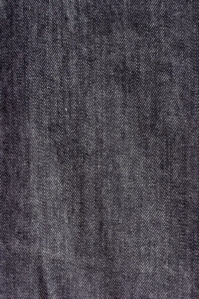 Konsistens av Blå jeans textil på nära håll i vinjetten med kopia spa — Stockfoto