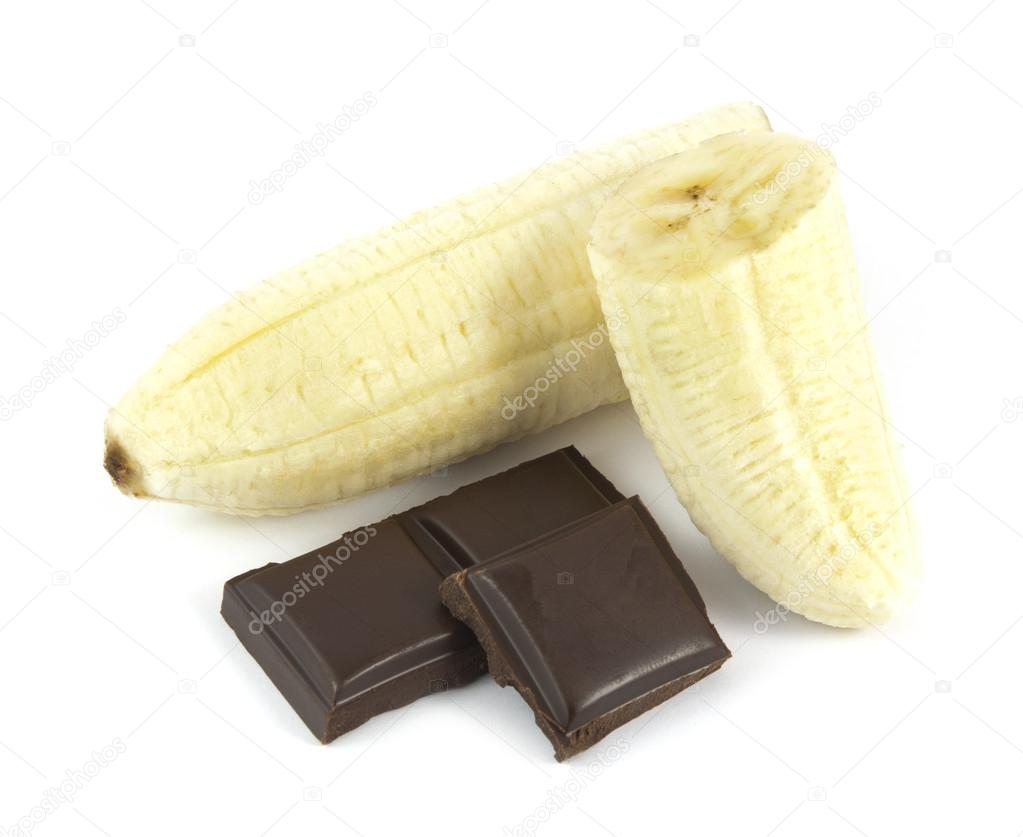 Sliced and peeled banana with chocolate pieces isolated on white background