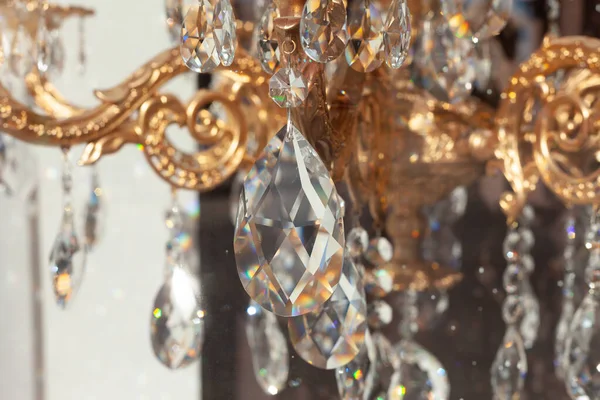 Chandeliers with glass and gold elements, beautiful home decor, apartment design