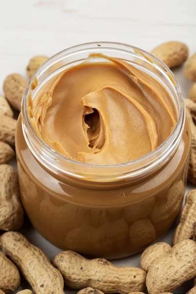 Creamy Smooth Peanut Butter Jar White Wood Table Natural Nutrition — Stock Photo, Image