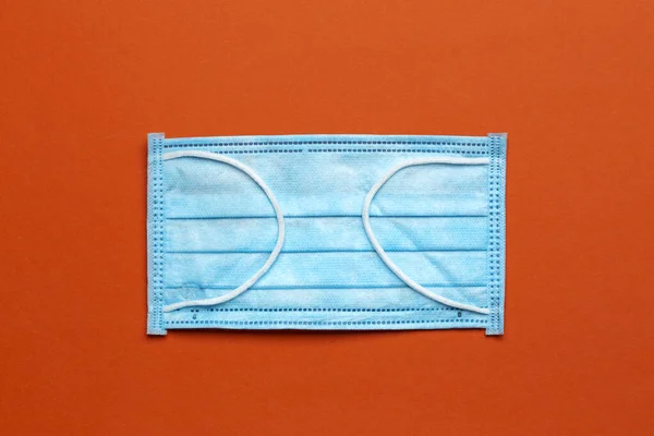 Синяя Медицинская Маска Оранжевом Фоне Защита Лица Загрязнения Вируса Гриппа — стоковое фото