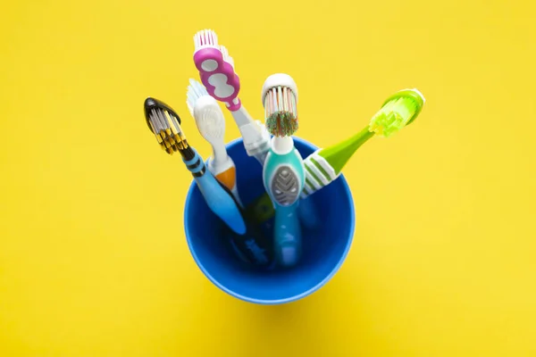 Toothbrushes Cup Yellow Background Health Care Dental Hygiene Space Text — Stock Photo, Image