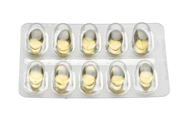 白い背景に錠剤ブリスター カプセル 鎮痛剤 抗生物質 ビタミンの錠剤包装のレイアウト 医学的概念 ファイルにクリッピングパスが含まれています — ストック写真