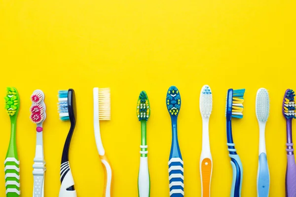 Toothbrushes Yellow Background Health Care Dental Hygiene Space Text Top — Stock Photo, Image