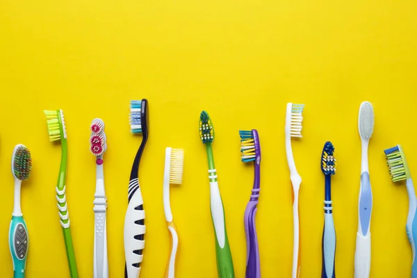 Toothbrushes Yellow Background Hygiene Oral Cavity Top View — Stock Photo, Image