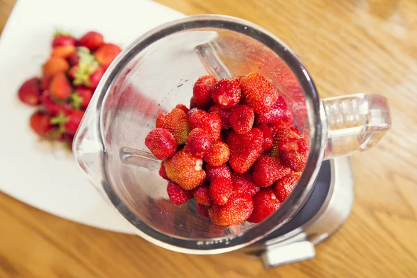 Strawberries in a blender — Stock Photo, Image