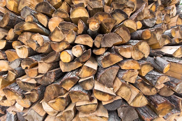 Firewood stacked for heating fireplace — Stock Photo, Image