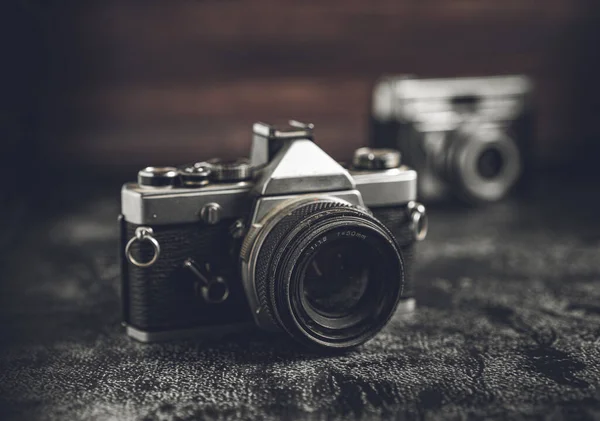 Film retro cameras with shallow depth of field. Camera technology and photography concept with a vintage look with copy space.