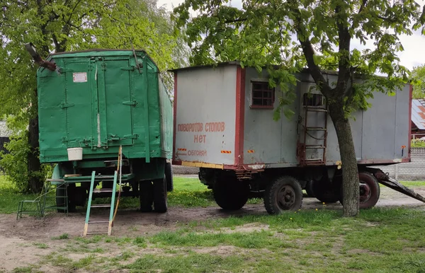 Construction trailer for office, change houses. Close up photo of a construction trailer at a construction site. Inscription - no turns or stops, overtaking.