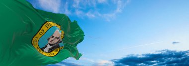 Gün batımında bulutlu arka planda Washington bayrağı. Devlet hakkında vatansever bir kavram. 3d illüstrasyon