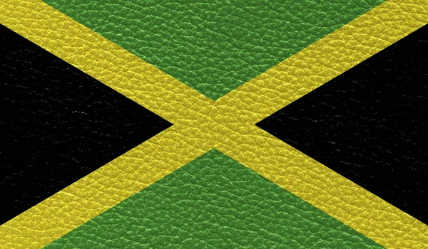 자메이카의 국기가 텍스처 배경에 인쇄되었다 위에서 — 스톡 사진