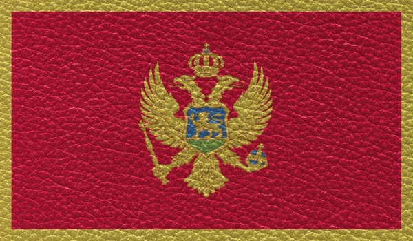 Επίπεδη Σημαία Μαυροβουνίου Τυπωμένη Φόντο Δερμάτινης Υφής Άνω Όψη — Φωτογραφία Αρχείου