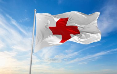 Minsk, Belarus - Mayıs 2021: Uluslararası Kızılhaç Komitesi bayrağı, arkasında açık mavi gökyüzü. Kızılhaç Hareketi uluslararası insani yardım kuruluşlarıdır. 3d illüstrasyon.