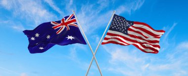 ABD ve Avustralya 'nın bayrakları güneşli bir günde gökyüzüne doğru bayrak direkleri sallıyor. İki ülke arasındaki ilişkiyi, diyaloğu sembolize ediyor. 3d illüstrasyon,