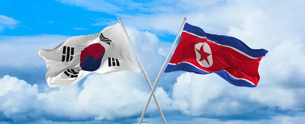 Güney Kore Kuzey Kore Bayrakları Rüzgarda Dalgalanırken Bayrak Direkleri Gökyüzüne — Stok fotoğraf