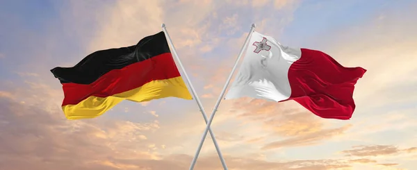 Flaggor Tyskland Och Malta Vinka Vinden Flaggstänger Mot Himlen Med — Stockfoto