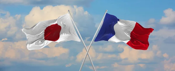 Flaggor Japan Och Frankrike Vinka Vinden Flaggstänger Mot Himlen Med — Stockfoto