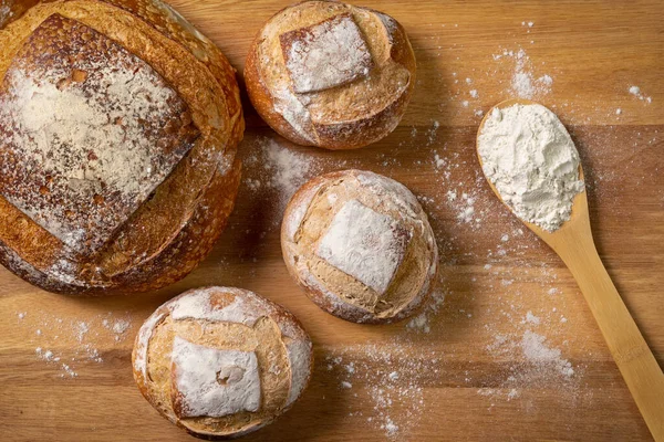 Traditional Italian bread with natural fermentation. Wooden base and top view.