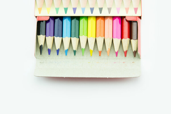 Idea from multicolored pencils isolated on white background.