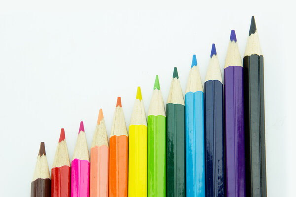 Idea from multicolored pencils isolated on white background.