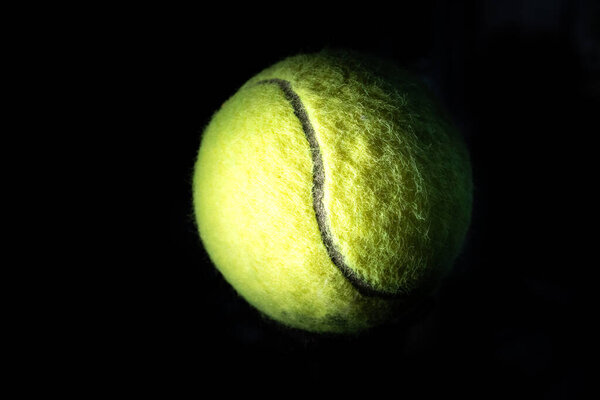 Dramatically Lit Isolated Angled Tennis Ball