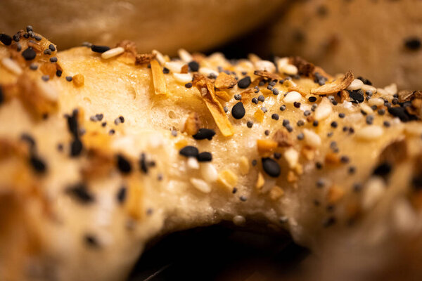 Close up of homemade everything bagel and seasoning