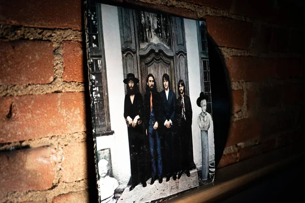 stock image Closeup of Front of The Beatles Hey Jude (The Beatles Again) Vinyl Album and Sleeve Leaning Against Brick Wall