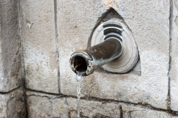 Drinking fountain with stream of water