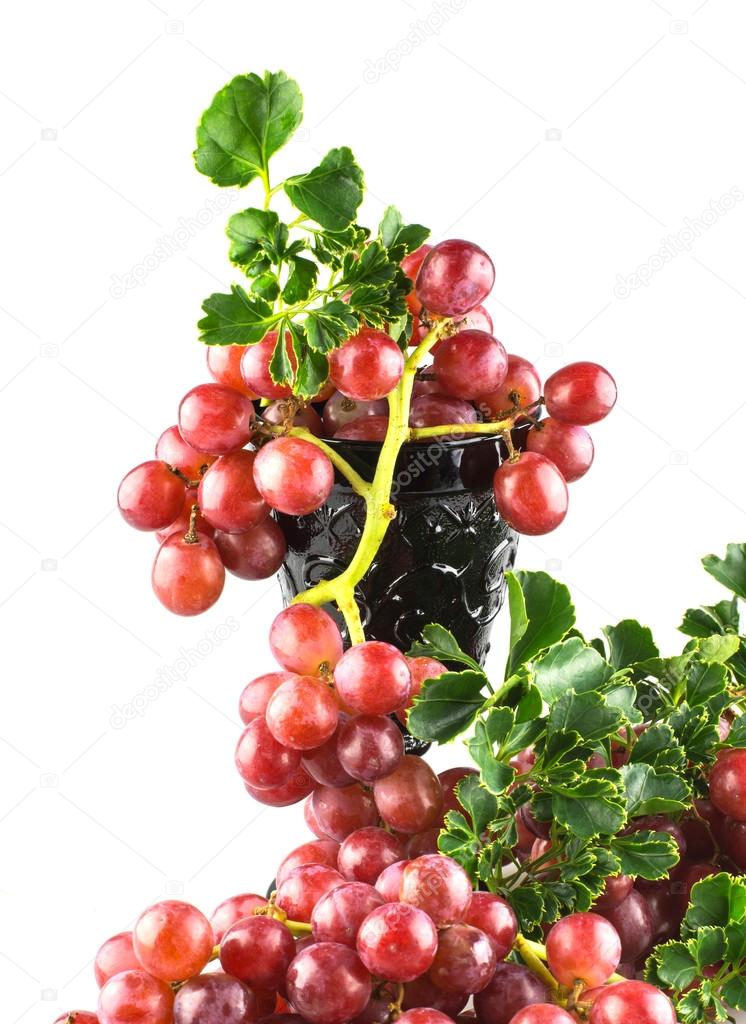 Ripe red grapes with glass isolate