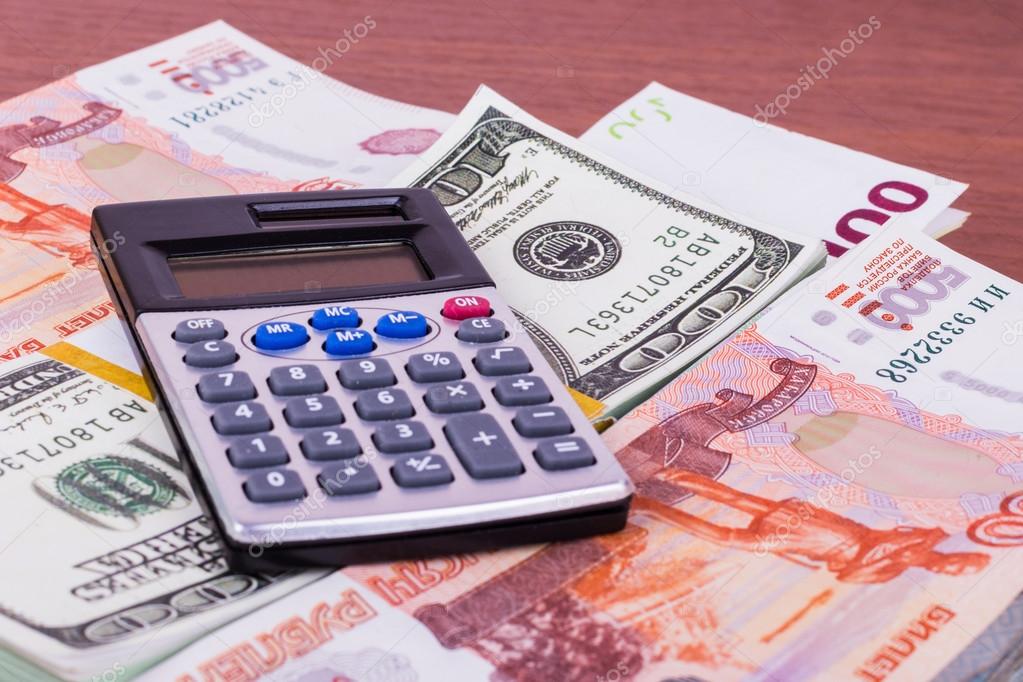 A lot of money in different currencies and calculator