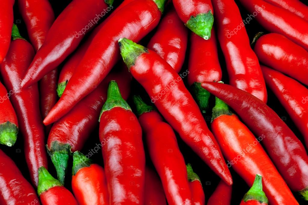 Small Red Chilli Peppers Close Up — Stock Photo © Bigal04uk 80358986