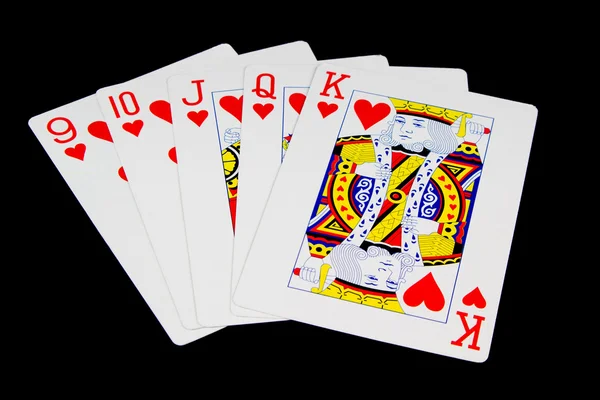 Juego de cartas mano sobre fondo negro — Foto de Stock