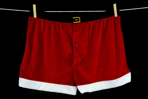 Christmas Underwear on Washing Line on Black Background — Stock Photo, Image