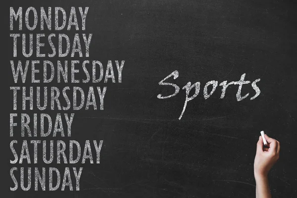 Письменное сообщение 7 day of week on chalk board background and spor — стоковое фото