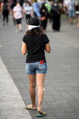MUMBAI/INDIA- JUNE 10, 2020: People walk at the Marine Drive promenade after the government eased a lockdown imposed as a preventive measure against the COVID-19 coronavirus
