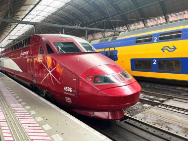Amsterdam, Netherlands. October 10, 2025. International trains waiting at a platform at the Amsterdam station. High quality photo