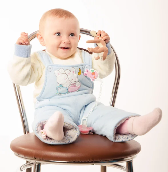 Baby sitting on a chair, studio — Stock Photo, Image