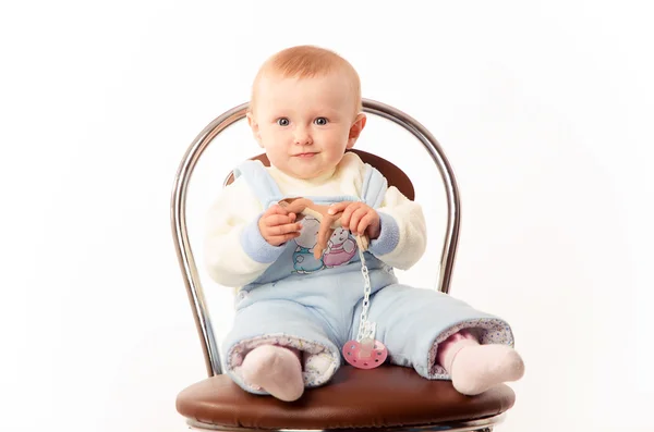 Baby sitting on a chair, studio — Stock Photo, Image