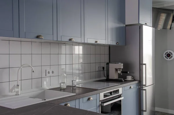 Minimalistic Scandinavian blue-gray kitchen. Clean background