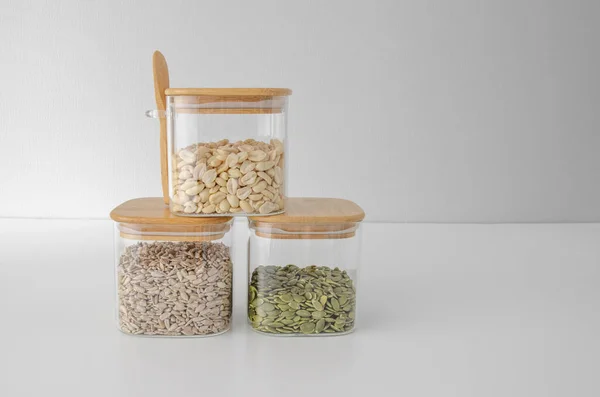 Storage of bulk products in glass jars: pumpkin seeds, sunflower seeds, peanuts