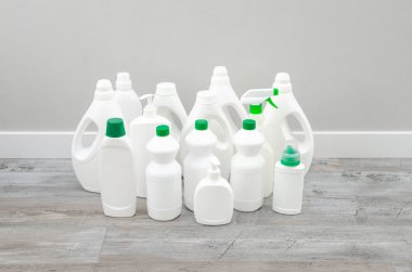 Clean plastic white bottles from household chemicals, the concept of waste, and plastic recycling.