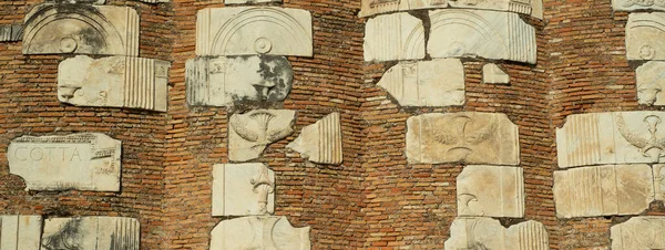 Ancient Appian Way in Rome, a Roman bas-relief reconstructed with brick blocks. Banner size