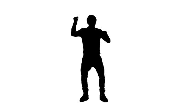 Silhouette eines Jungen, der im Studio tanzt — Stockvideo