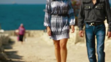 Young Couple Walking On The Coast