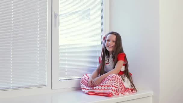 Girl 6-7 Years Sitting in the Window and Watch What is Happening on the Street. — Stock Video